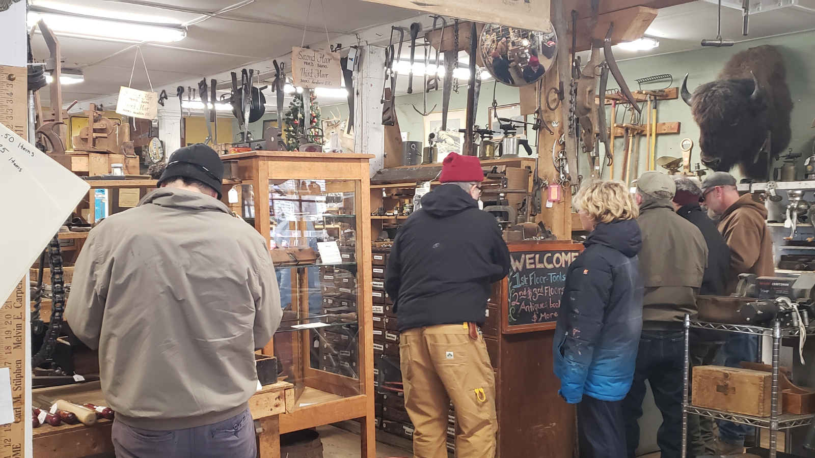 Customers browsing tools and antiques at Liberty Tool Company in Maine on opening day 2026